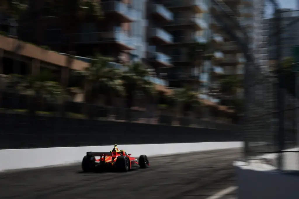 Indycar driver David Malukas speeds down the back stretch in...