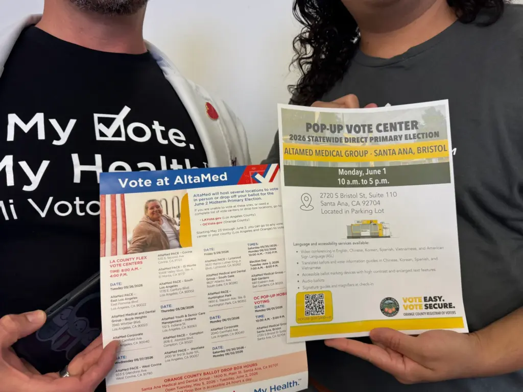 Dr. Ilan Shapiro and Jorge Gavino share flyers with early...