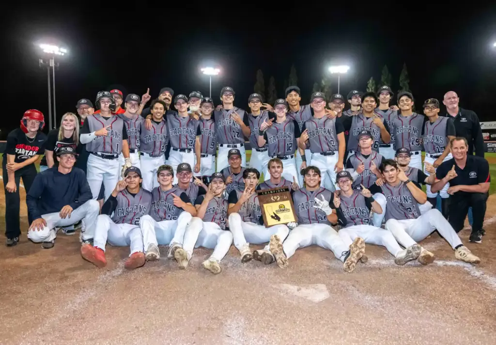 Glendora players celebrate with their CIF-SS championship trophy as they...