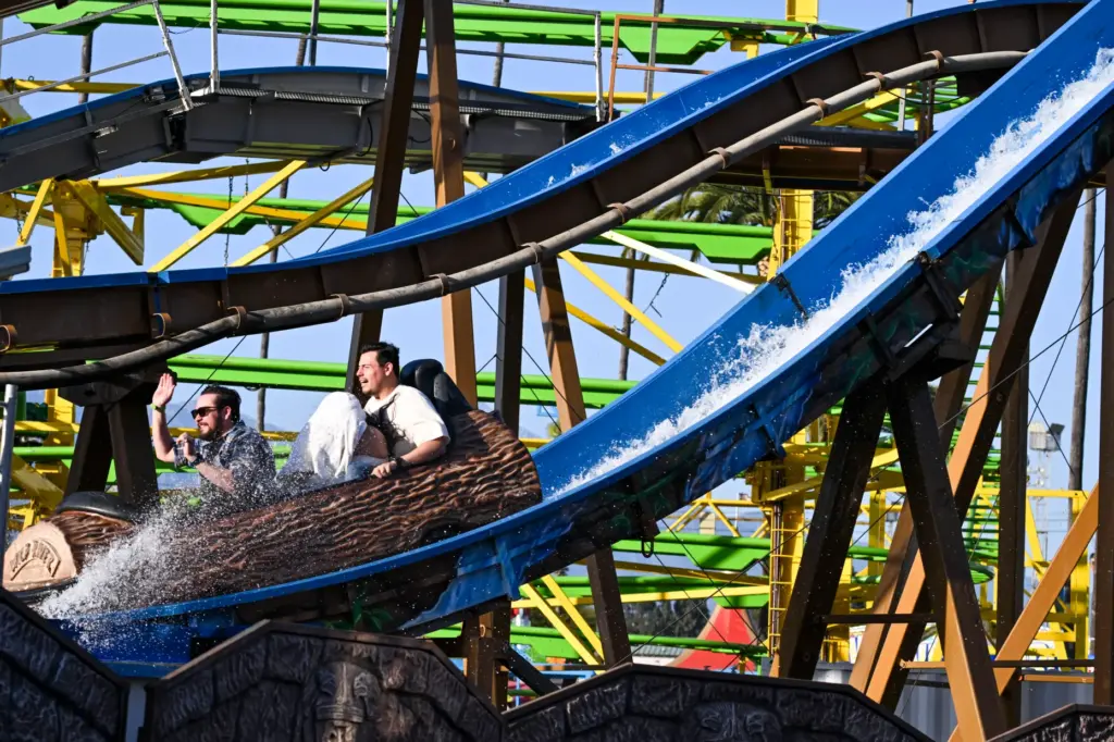 Fairgoers enjoy the rides during the final weekend of the...