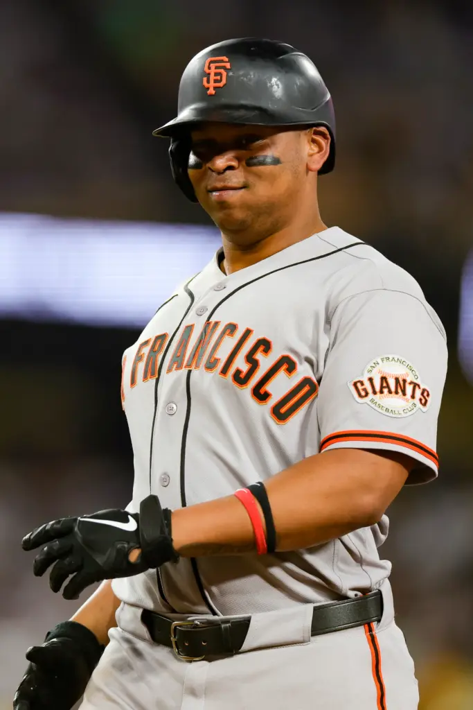 The San Francisco Giants’ Rafael Devers reacts after hitting a...