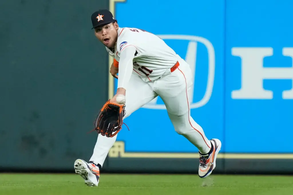 Houston Astros right fielder Cam Smith catches a fly ball...