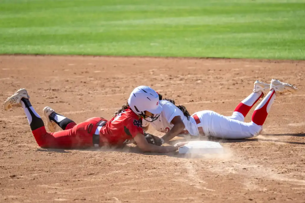 Whittier Christianâs Jaelyn Ugalde dives safely back to second base,...