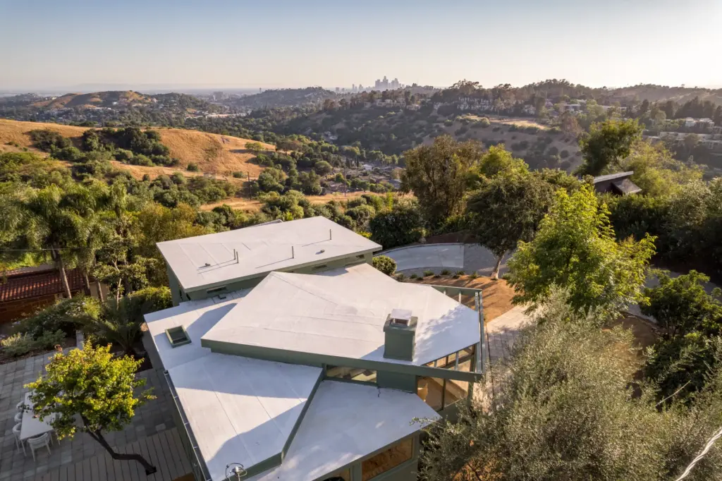 An aerial view shows the multi-tiered geometric rooflline of R.M....