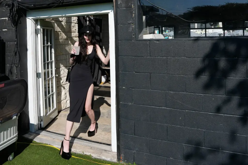 Zoe Raabe ducks as she passes through a doorway during...