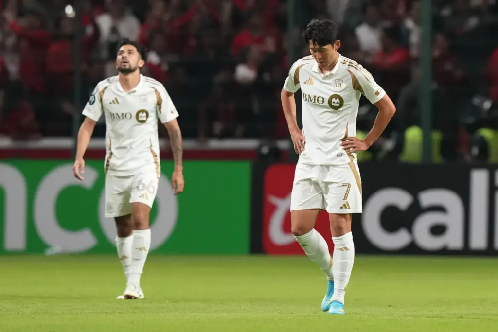 LAFC’s Son Heung-Min, right, and Mathieu Choiniere show their frustration...