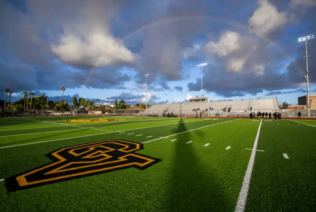 A rainbow appears over the newly renovated stadium at Capistrano...
