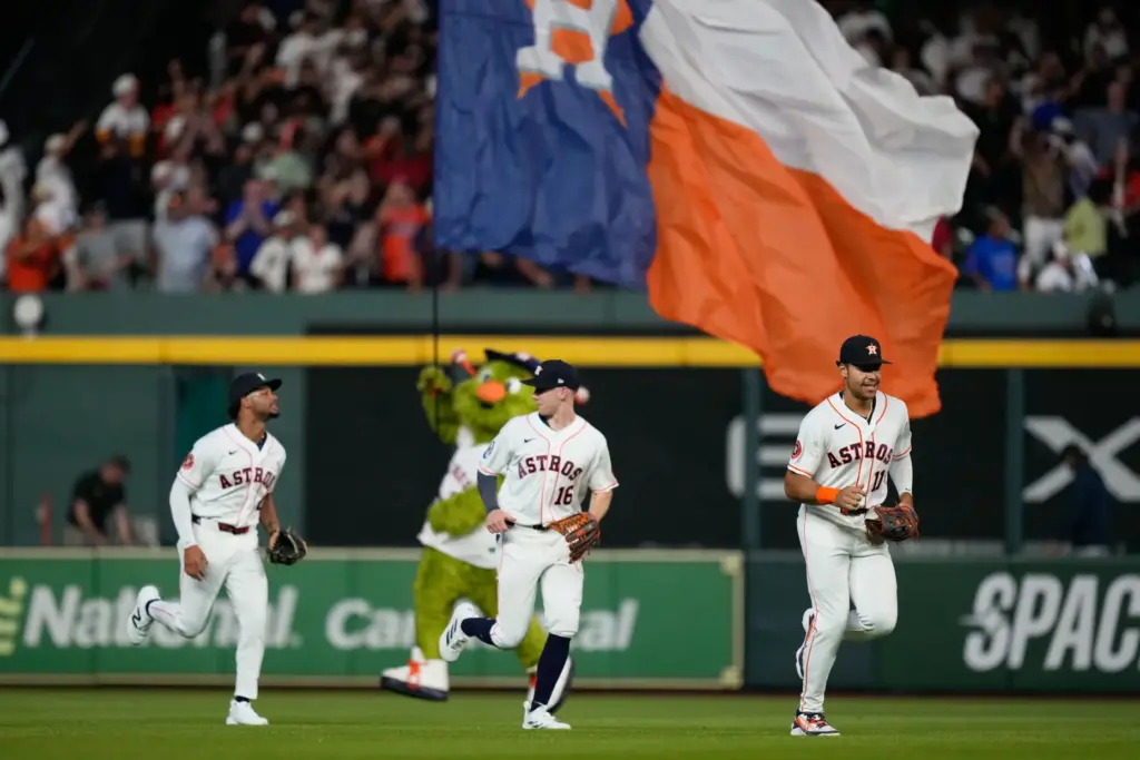 Houston Astros outfielders Yordan Alvarez, left, Zach Cole, center, and...