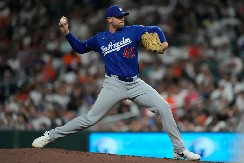 Dodgers relief pitcher Blake Treinen throws to the plate during...