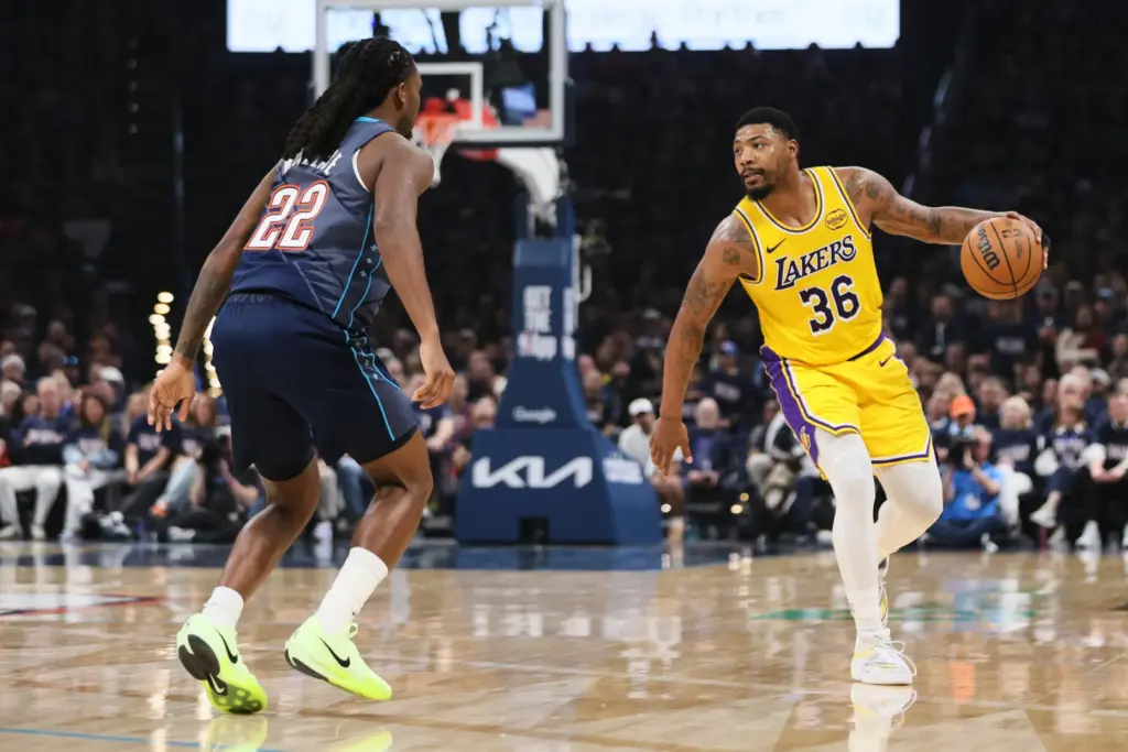 Los Angeles Lakers guard Marcus Smart (36) looks for an...