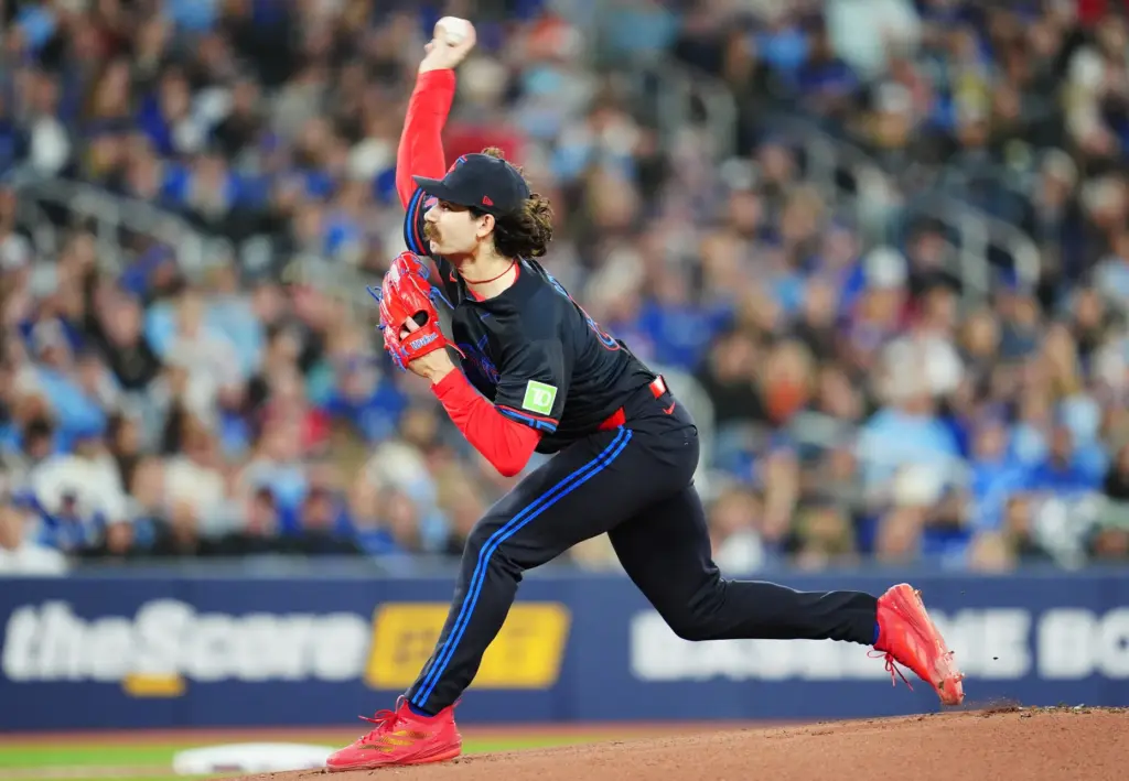 Toronto Blue Jays starting pitcher Dylan Cease throws to the...