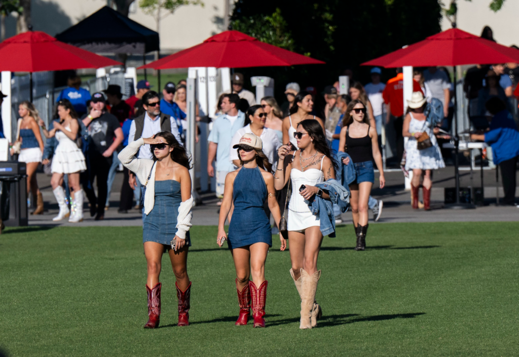Fans of Billy Currington enter the Great Park Live temporary...
