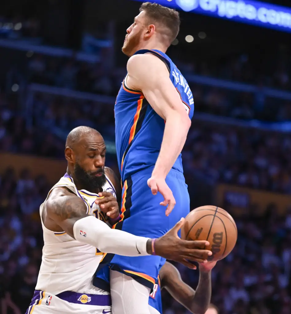 Lakers star LeBron James passes the ball around Oklahoma City...