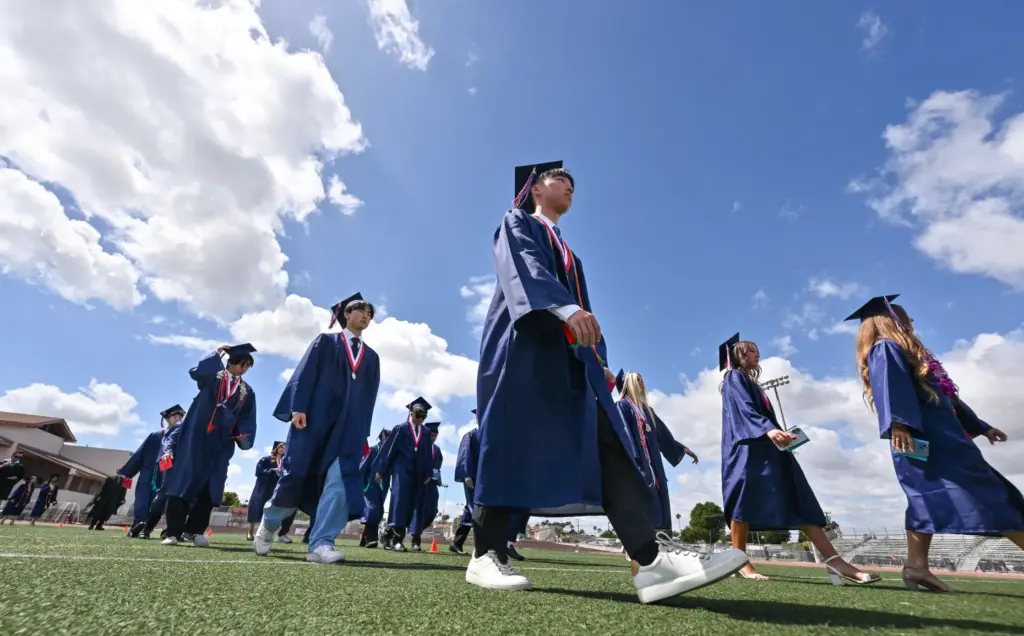 Graduates enter the commencement ceremony for Beckman High School at...