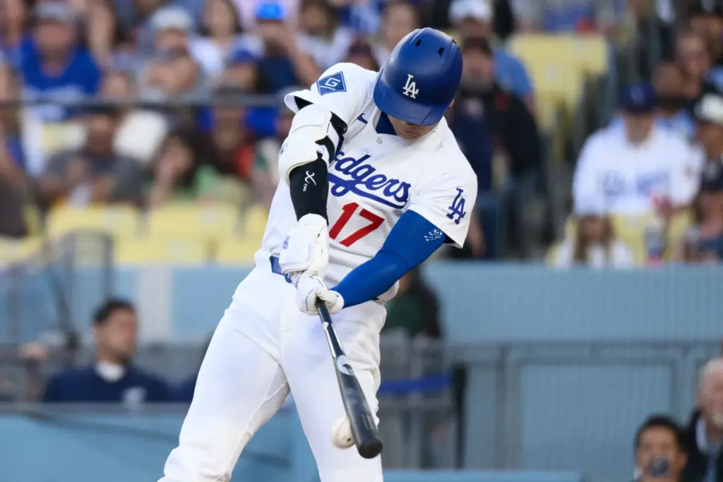 Dodgers star Shohei Ohtani swings at a pitch during the...