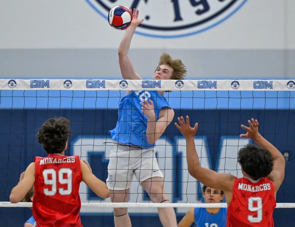 Corona del Mar middle hitter Jack Robinson gets an uncontested...