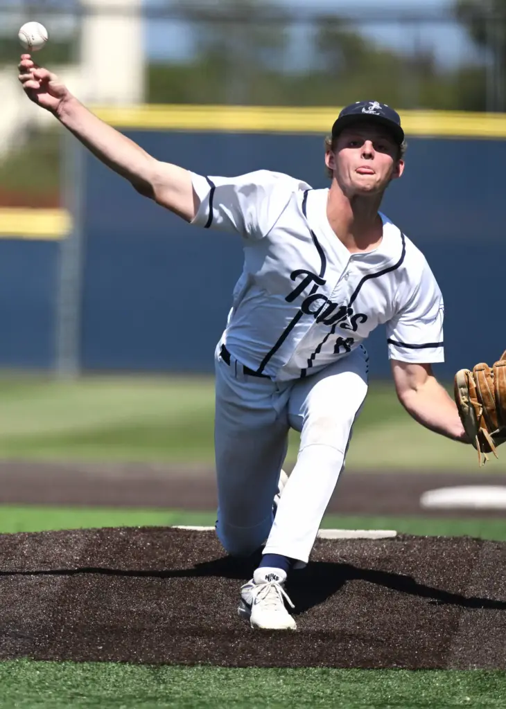 Gavin Guy (8) of Newport Harbor pitches against Trabuco Hills...
