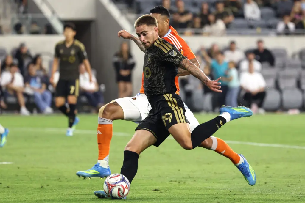 LAFC forward Tyler Boyd (19) winds up to kick the...
