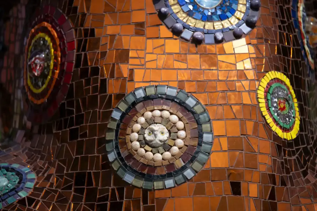 A detail of the mosaic dog sculpture titled Honey at...