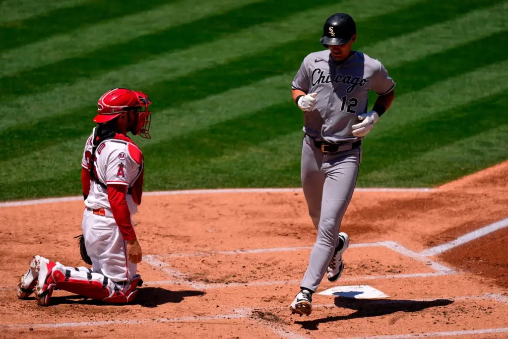 The Chicago White Sox’s Colson Montgomery, right, scores on a...