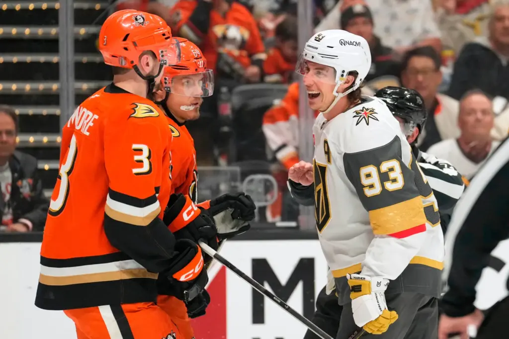 Vegas Golden Knights right wing Mitch Marner, right, laughs at...