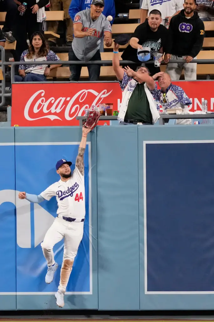 Dodgers center fielder Andy Pages can’t get to a ball...