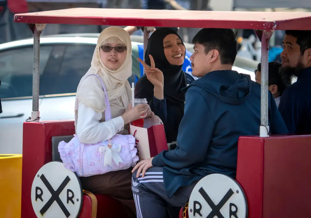 Visitors take in a train ride during the celebration of...