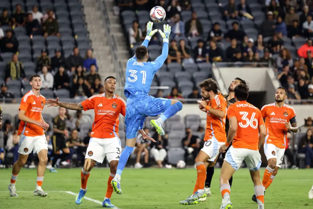 Houston Dynamo FC goalkeeper Jonathan Bond (31) catches the ball...