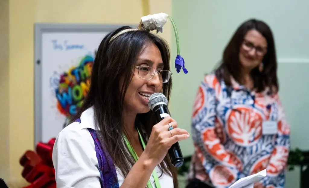 Ehibiits Manager Cindy Cruz speaks during the opening of The...