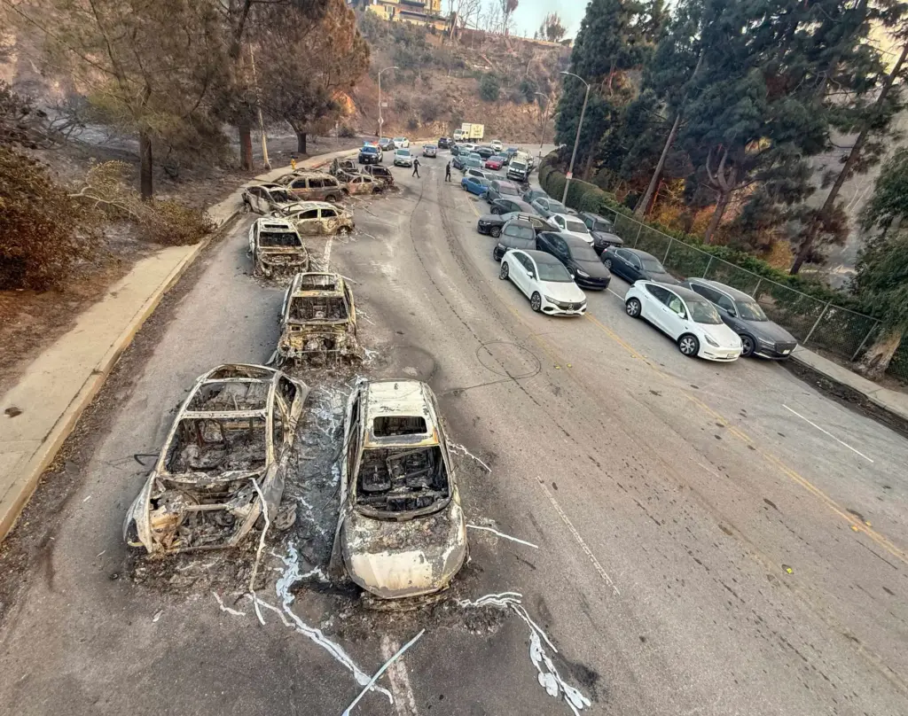 Abandoned cars sit on Sunset Boulevard during the Palisades Fire...