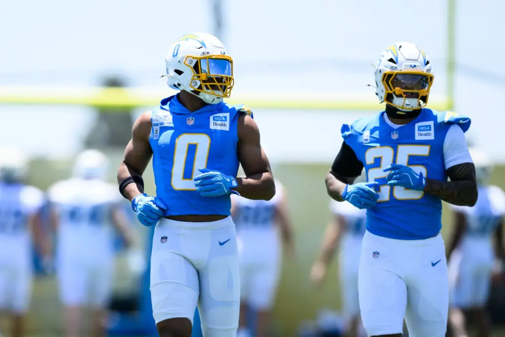 Chargers linebacker Daiyan Henley (0) warms up during the team’s...