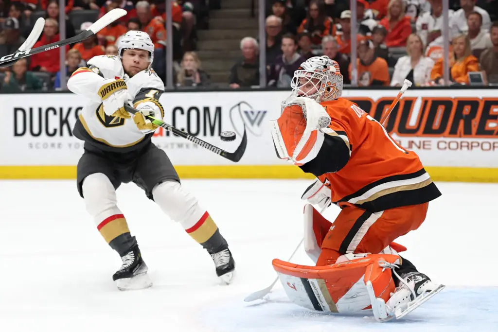 Ducks goaltender Lukas Dostal, right, defends the net as he...