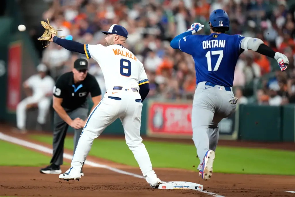 Dodgers designated hitter Shohei Ohtani, right, is forced out at...