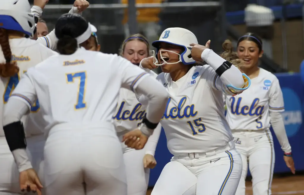 UCLAâs Jordan Woolery (15) celebrates with her teammates at home...