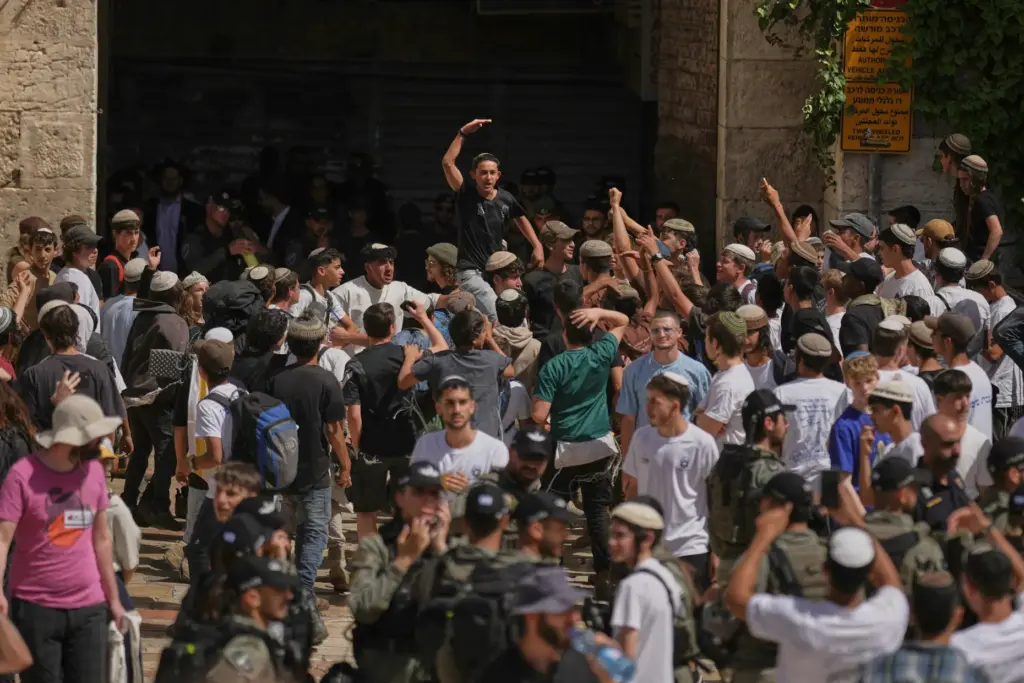 Israeli youth celebrate in Damascus Gate ahead of a march...