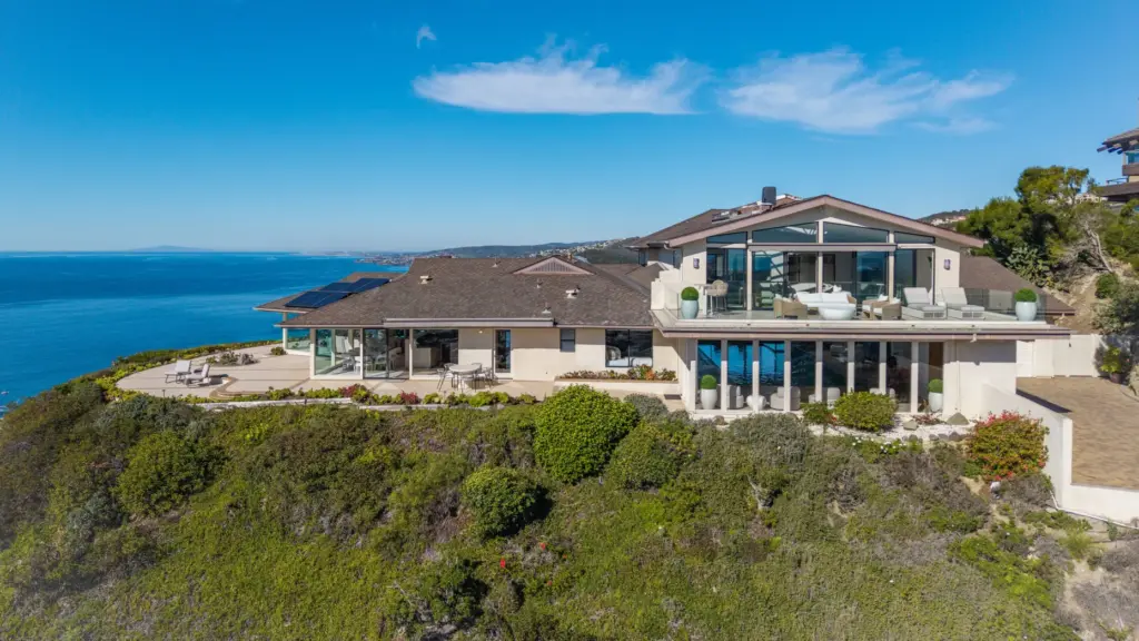 Perched on a more than three-quarter-acre lot, the hillside home...