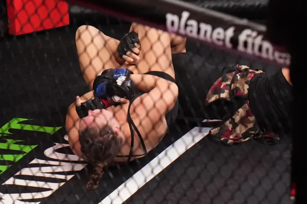 Ronda Rousey, of the United States, left, fights Gina Carano,...