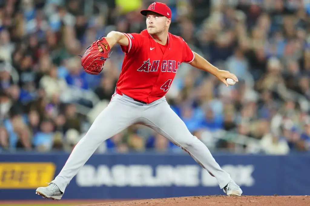 Angels starting pitcher Reid Detmers throws to the plate during...