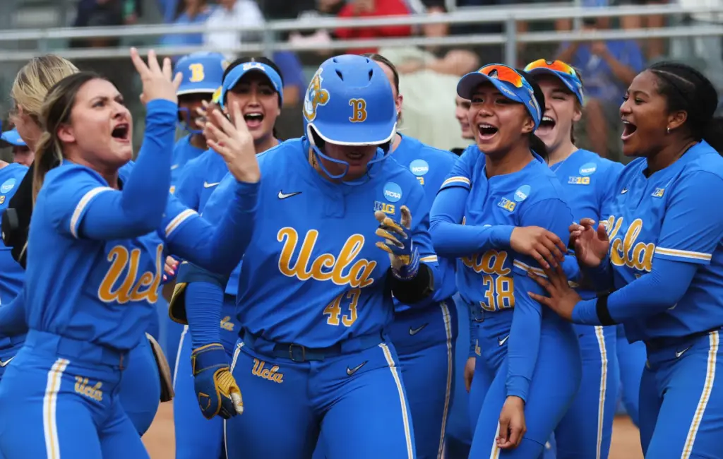 UCLA celebrates after Megan Grant (43) hit a grand slam...