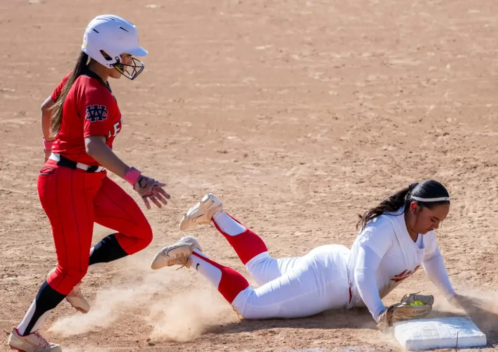 Mater Dei first baseman Tulutululelei Salue dives to the bag...