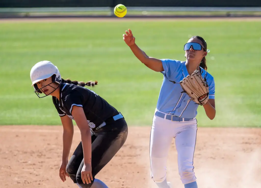 Irvine second baseman Arianna Santoyo throws to first base after...