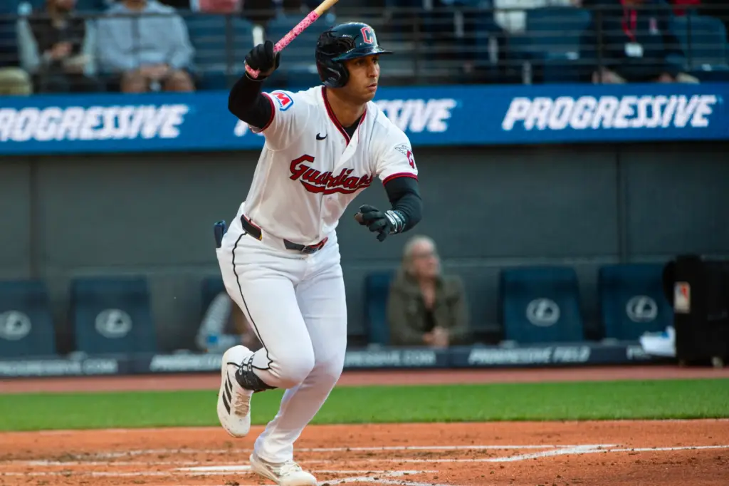 The Cleveland Guardians’ Brayan Rocchio watches his two-run single during...