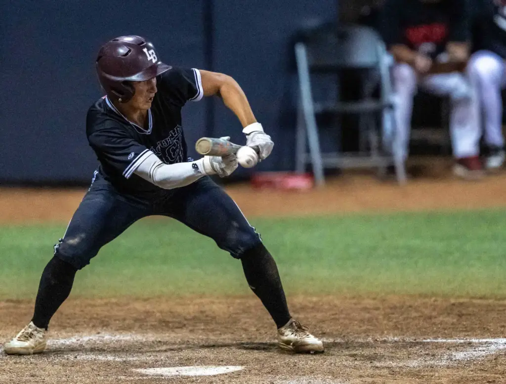 Laguna Beach infielder Lincoln Adams bunts during the CIF-SS Division...
