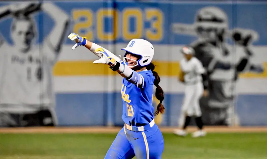 Aleena Garcia #21 of the UCLA Bruins reacts after hitting...