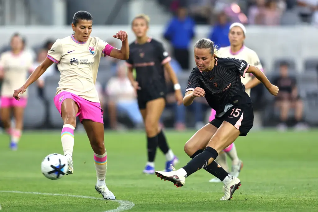 Angel City FC midfielder Evelyn Shores (15) kicks the ball...