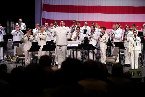 Lt. Joel Davidson directs the Navy Band Southwest performs as...