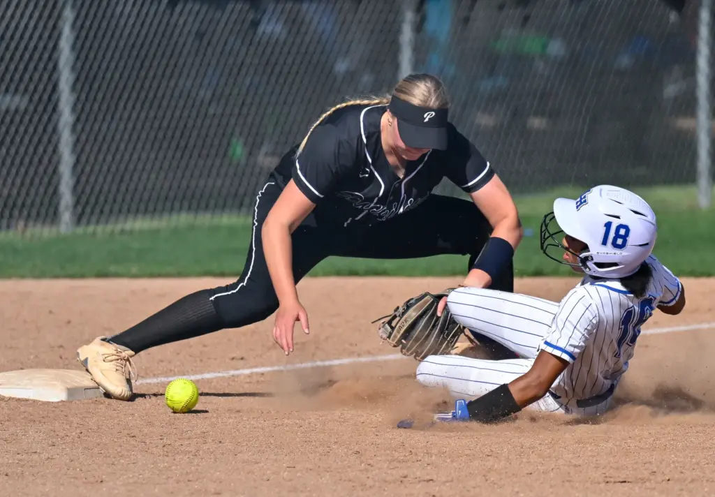 La Habra outfielder Georgia Rickenbacker slides safely into third base,...