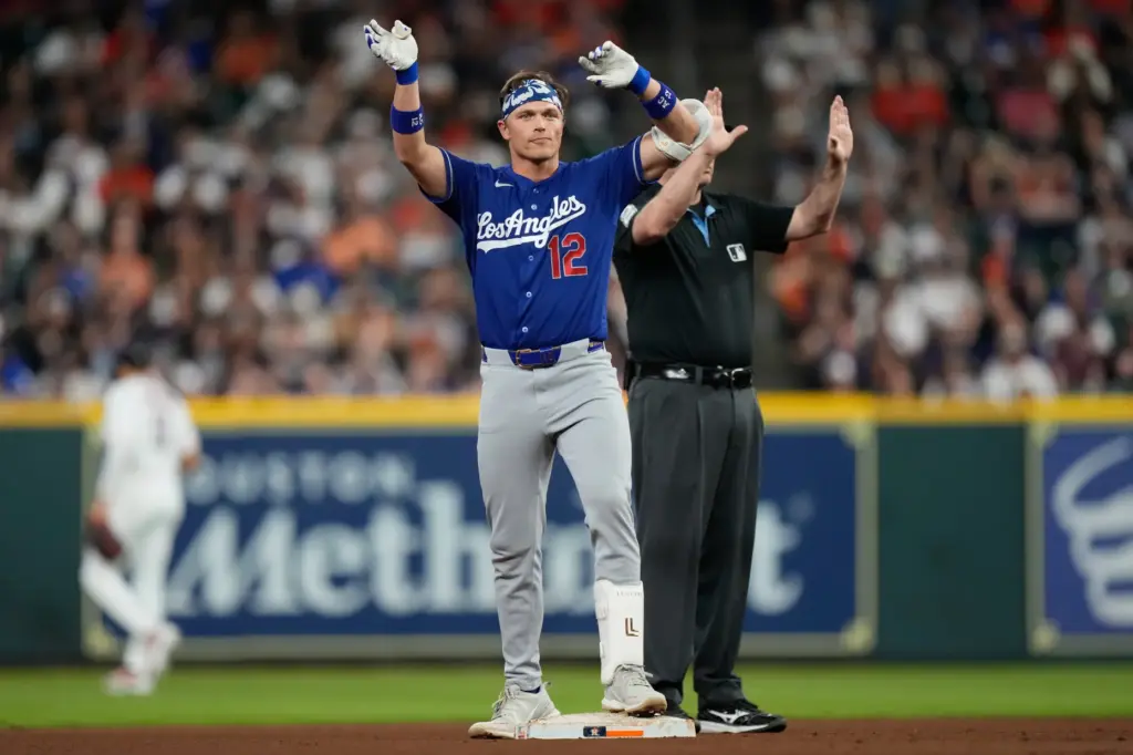 The Dodgers’ Alex Call celebrates at second base after hitting...
