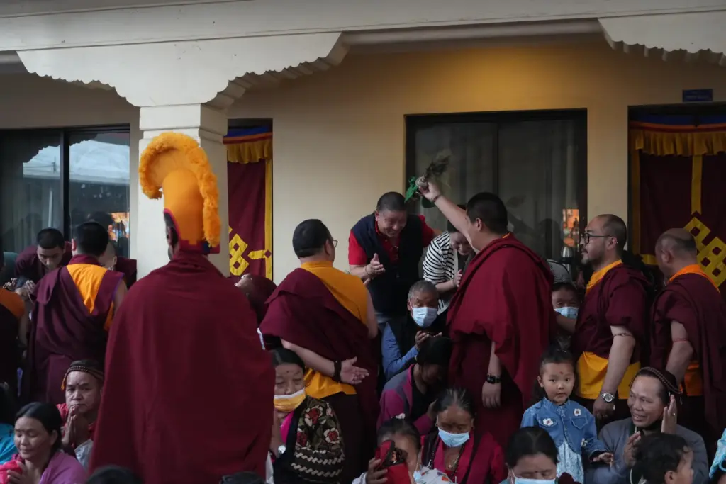U.S.-born Buddhist lama Jalue Dorje blesses his father, Dorje Tsegyal,...