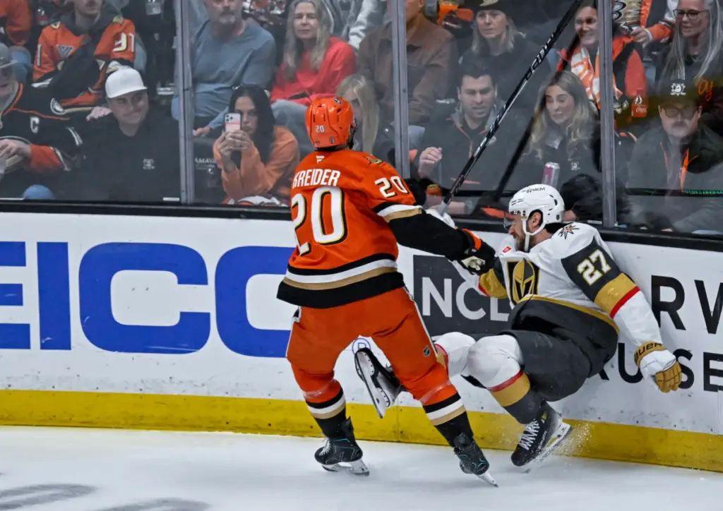 The Ducksâ Chris Kreider (20) checks the Golden Knightsâ Shea...